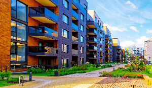 The sixth puzzle piece in a series, completing the vibrant image of a modern rental housing property, symbolizing the culmination of multifamily risk management strategies